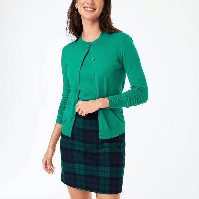 green cotton twinset cardigan and shell with a Blackwatch plaid skirt