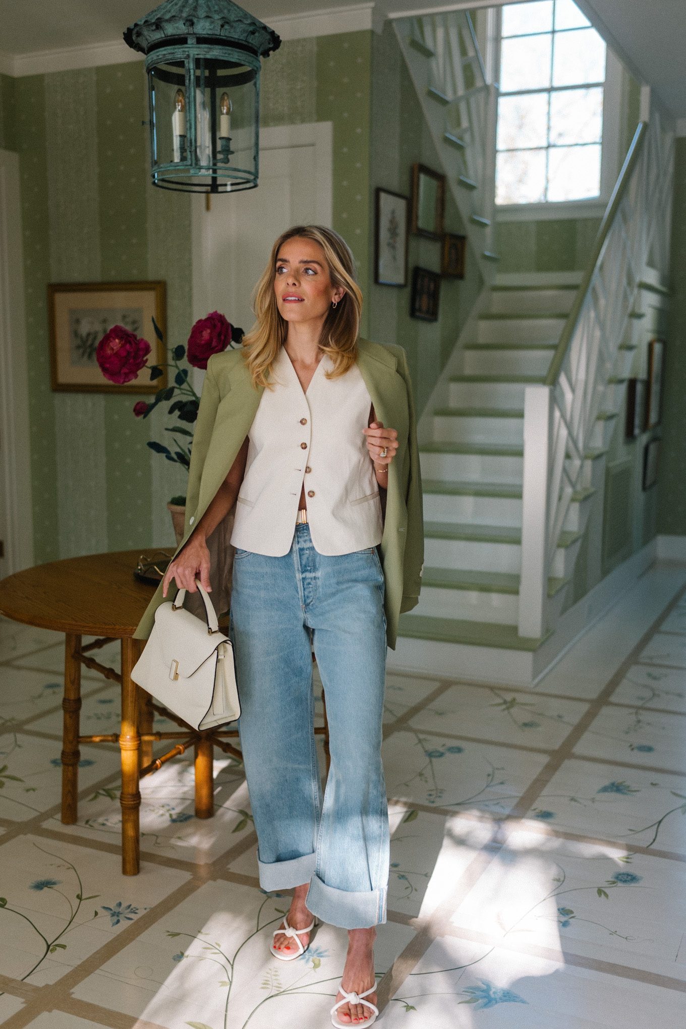 blue jeans white heels cream vest green blazer