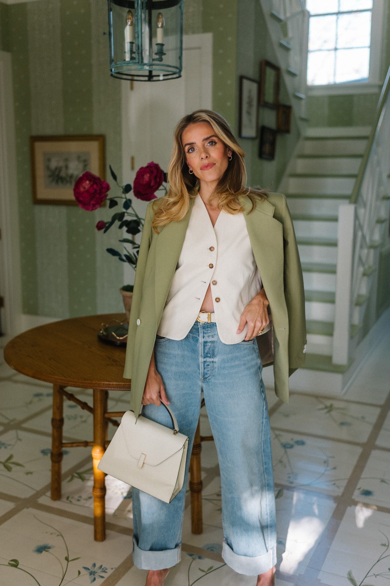 blue jeans white heels cream vest green blazer