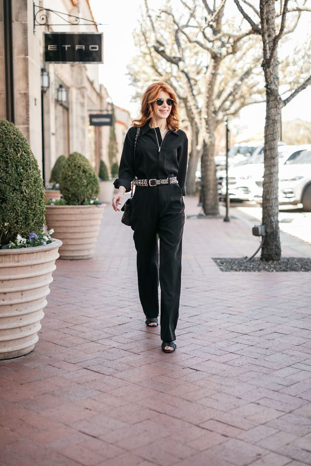 JUMPING INTO SPRING IN A BLACK JUMPSUIT