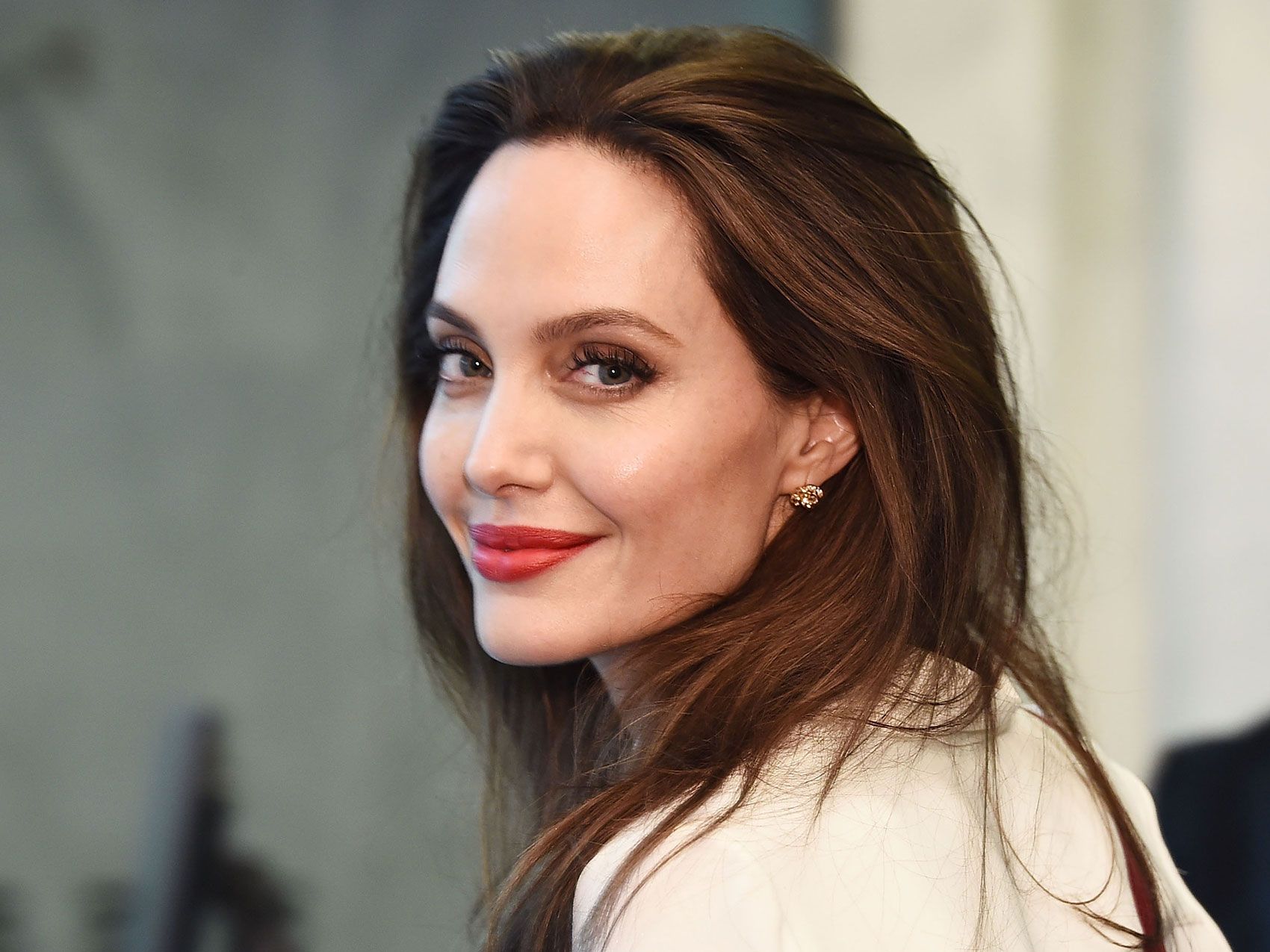 Angelina Jolie’s Timeless Coat and Boots Go Together Like PB&J