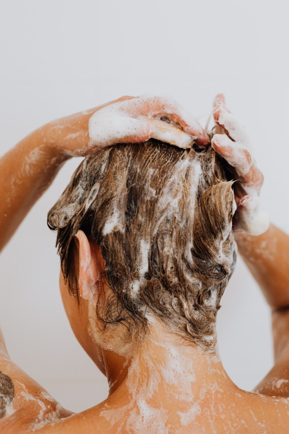 Why we should shower and wash our hair less often