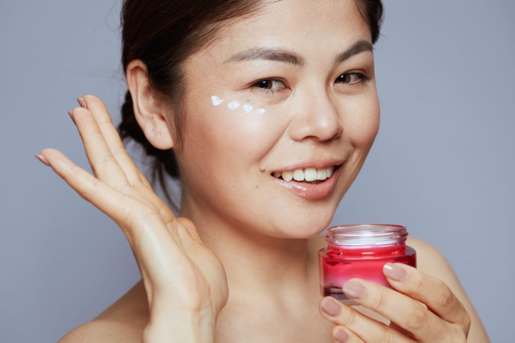 Girl applying night cream