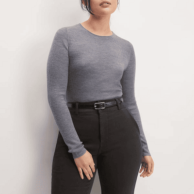 woman wears dark gray merino wool sweater