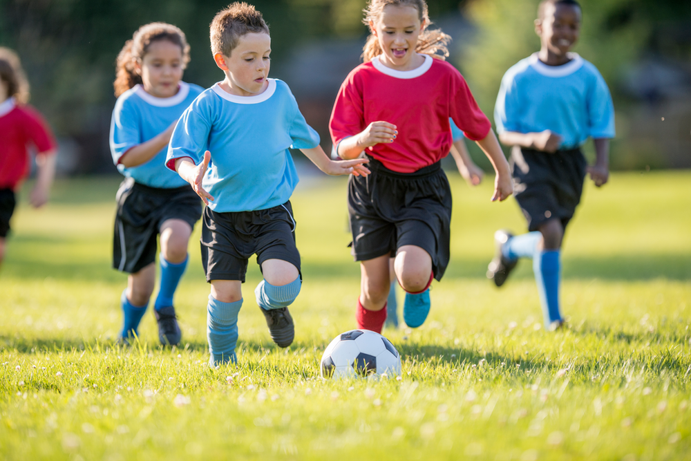 friends playing soccer