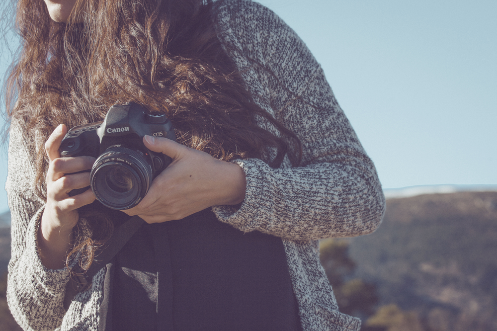 holding a camera