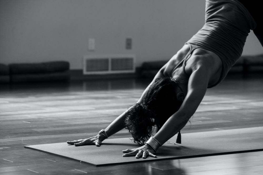 woman stretching on a yoga mat
