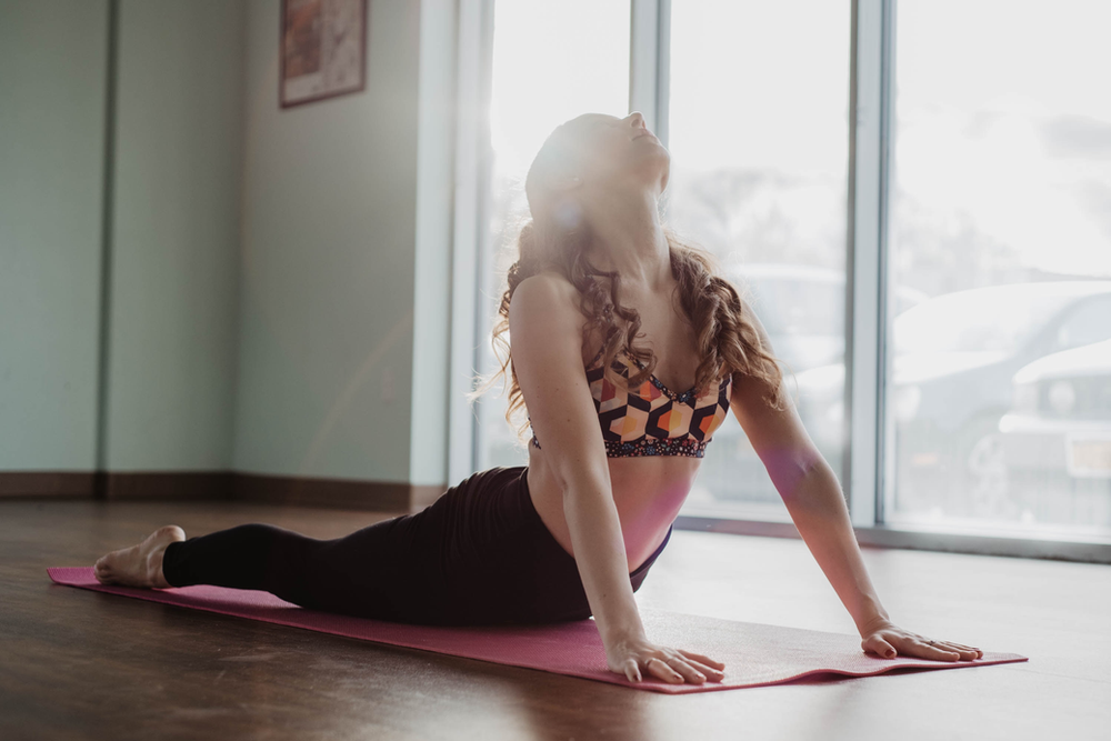 woman doing a pilates workout at home