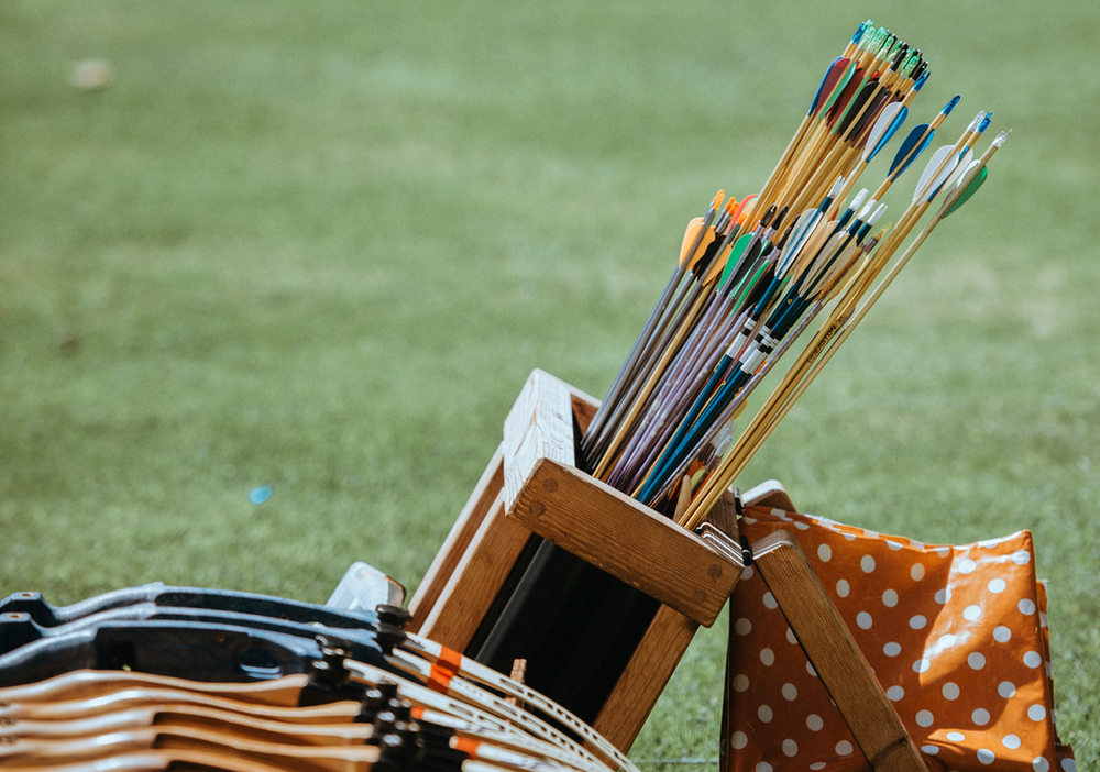 archery arrows in a basket