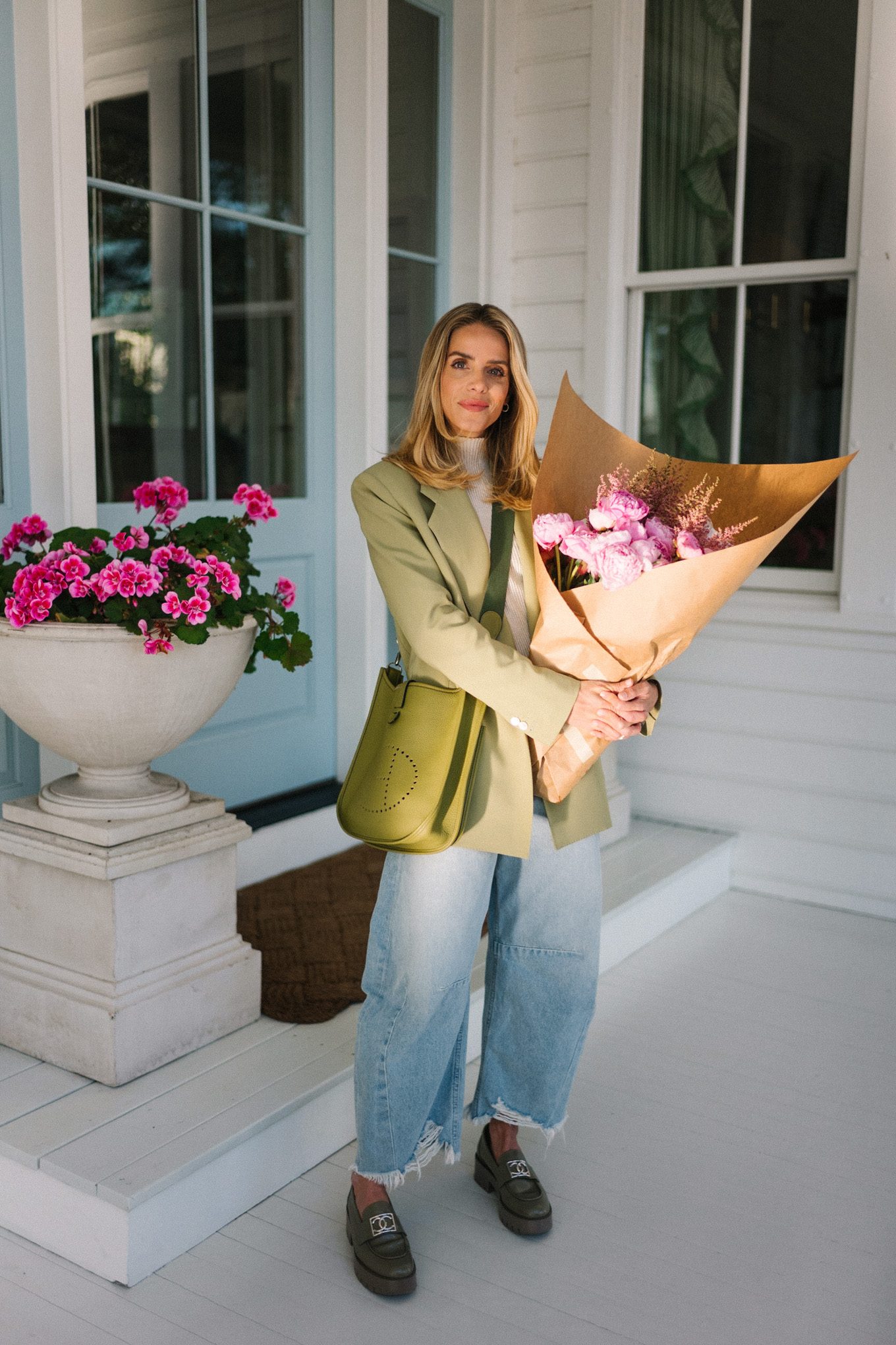 green blazer cream turtleneck blue horseshoe jeans