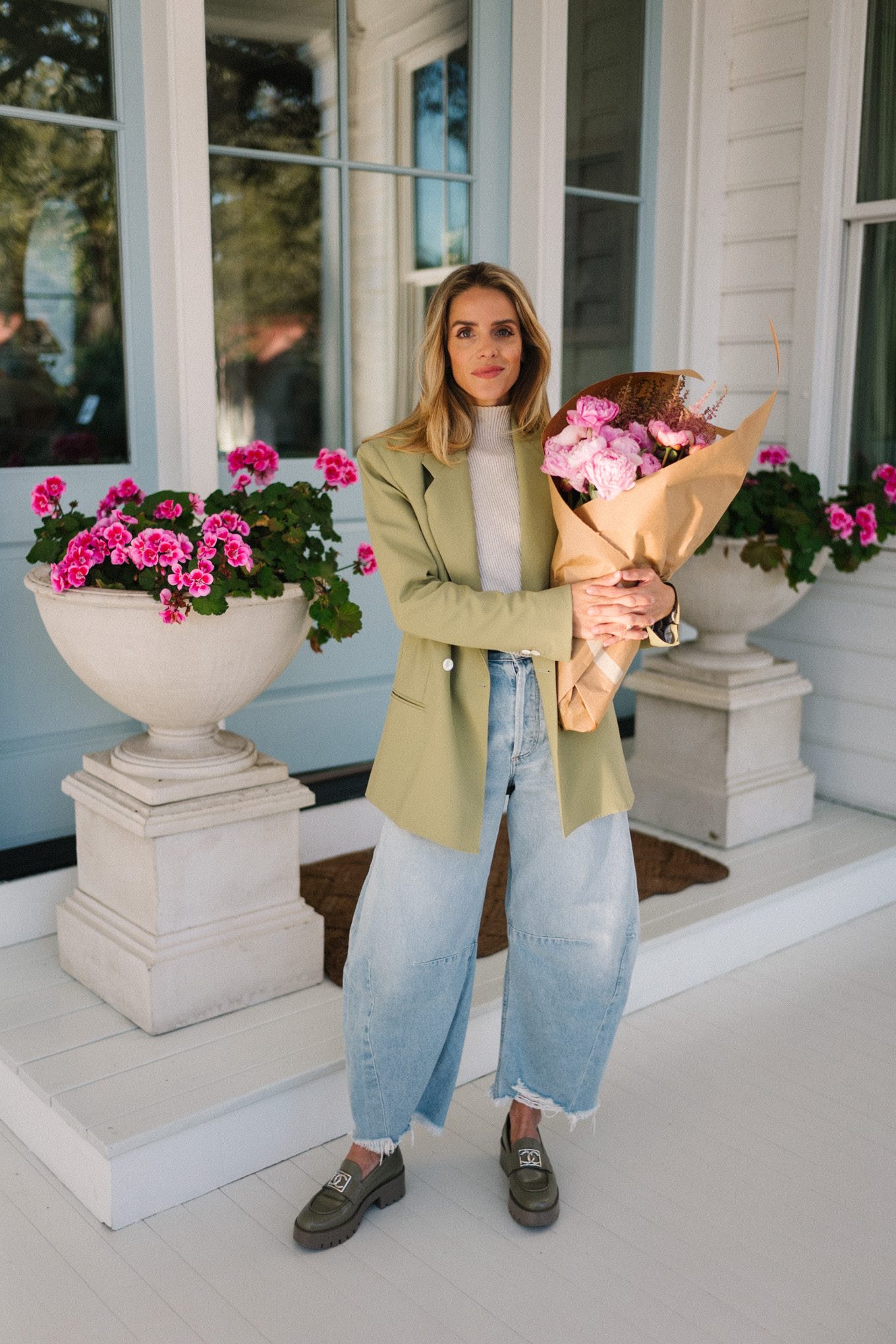 green blazer cream turtleneck blue horseshoe jeans