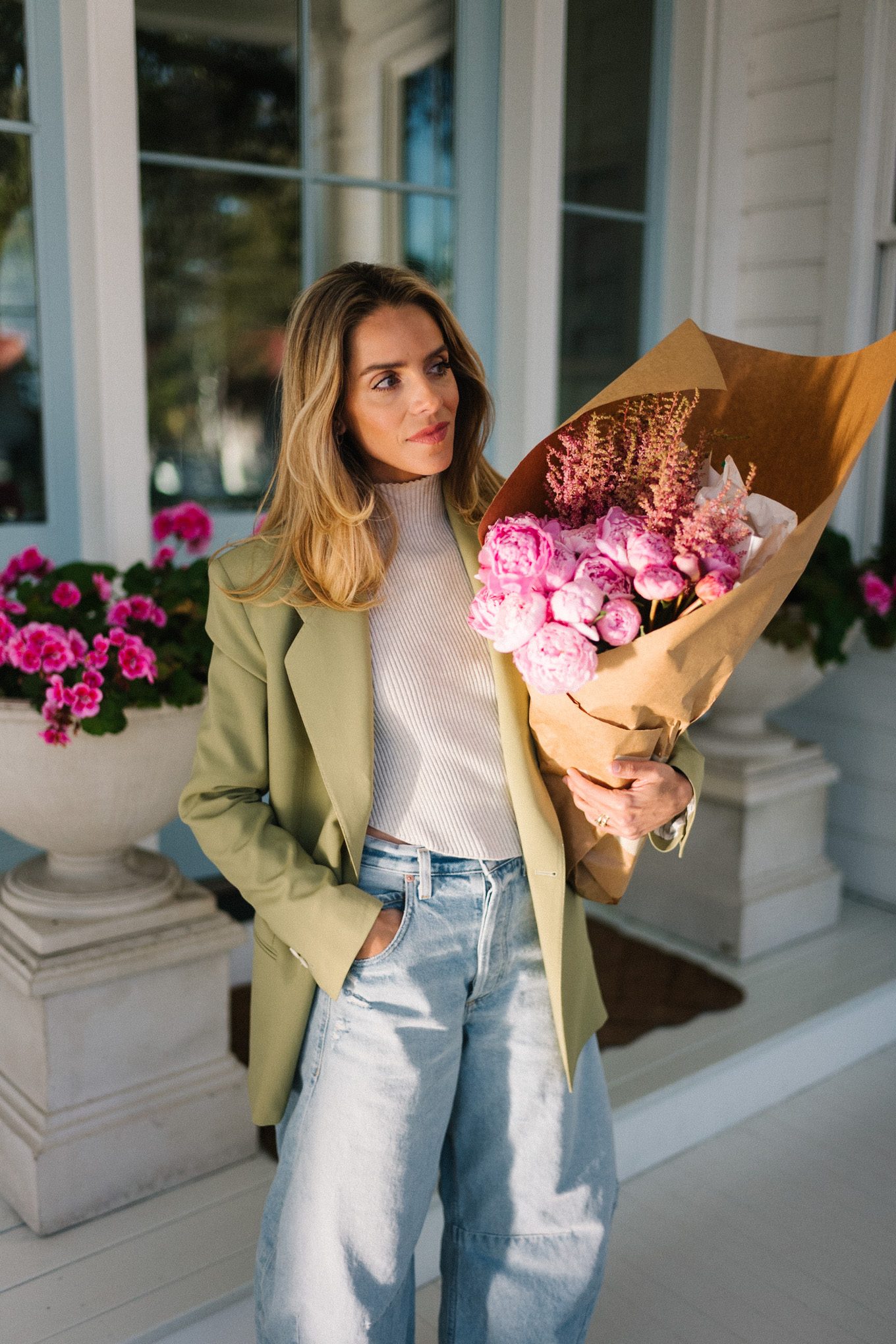 green blazer cream turtleneck blue horseshoe jeans