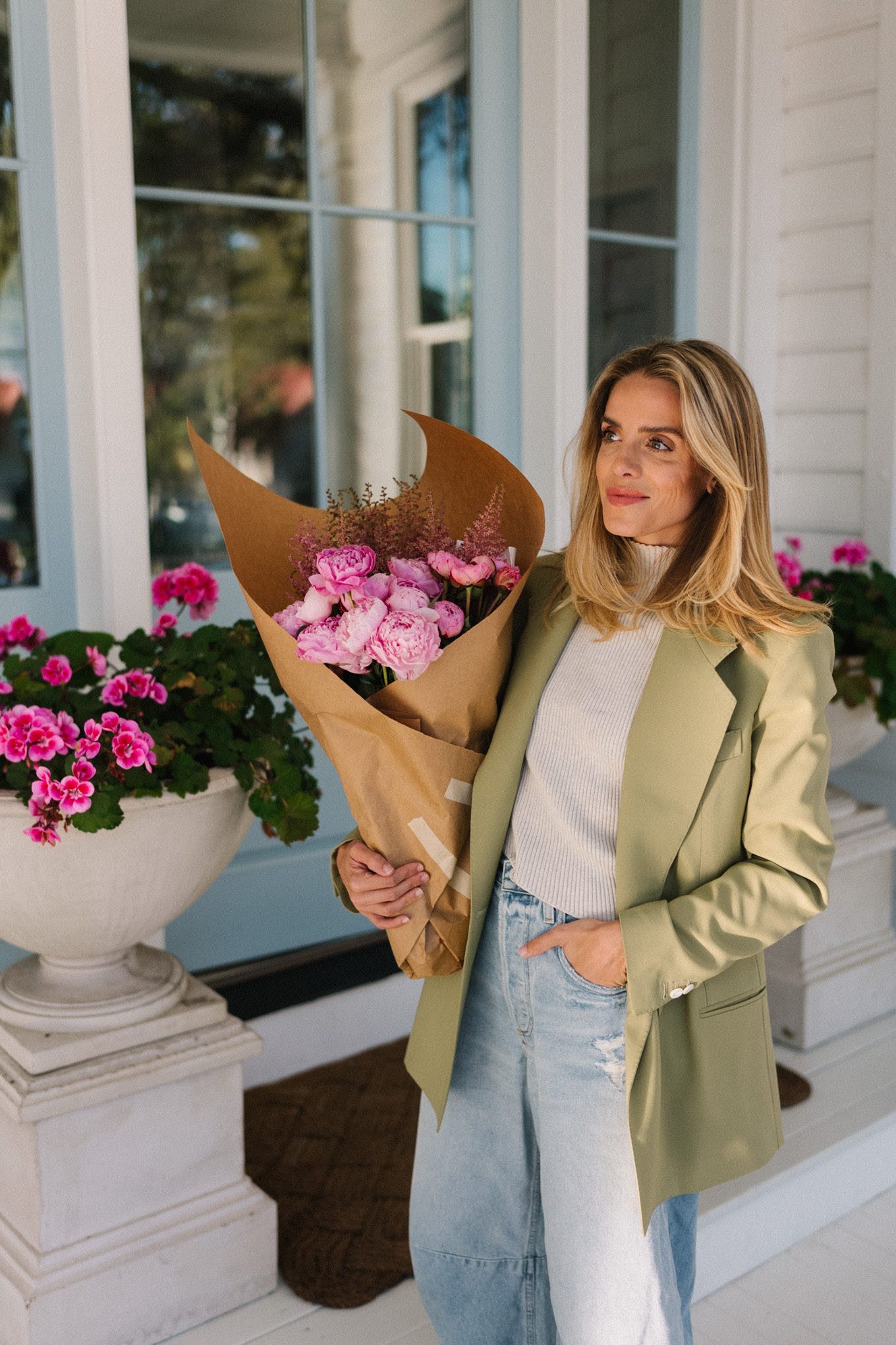 green blazer cream turtleneck blue horseshoe jeans